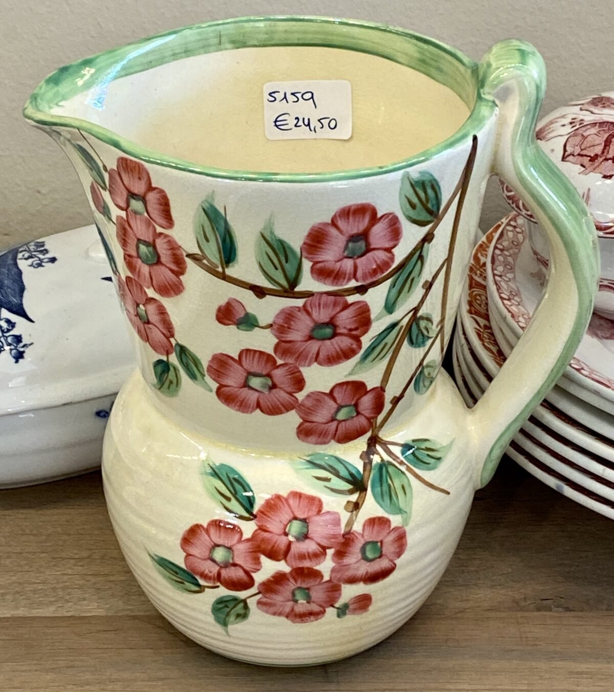 <p>Vaasje met handgreep - Bewley Pottery - Made in England - Melton - décor in pastelgele ondergrond met roze bloesem</p> - Overig Engeland