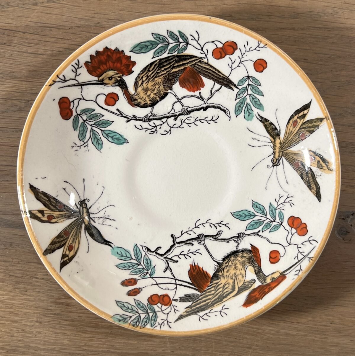 <p>Kommetje met schoteltje - Societe Ceramique Maestricht - décor OISEAUX-MOUCHES met oranje luster</p> - Sociéte Céramique